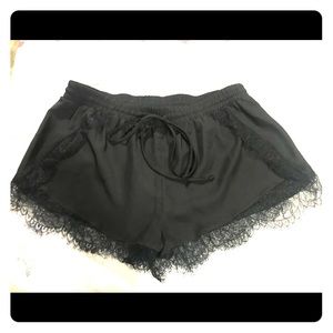 Black BCBGeneration silky lace-trimmed shorts